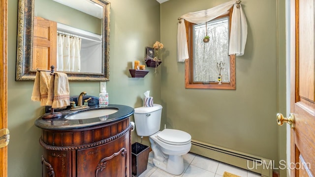 bathroom featuring vanity, a baseboard heating unit, tile patterned floors, and toilet