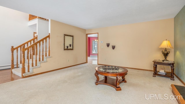 carpeted living room with a baseboard radiator