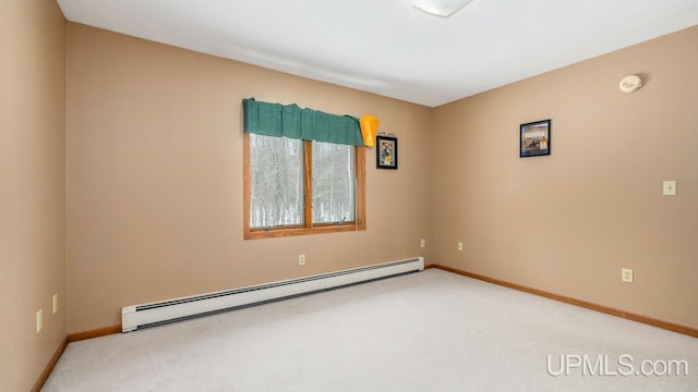 unfurnished room with a baseboard radiator and carpet