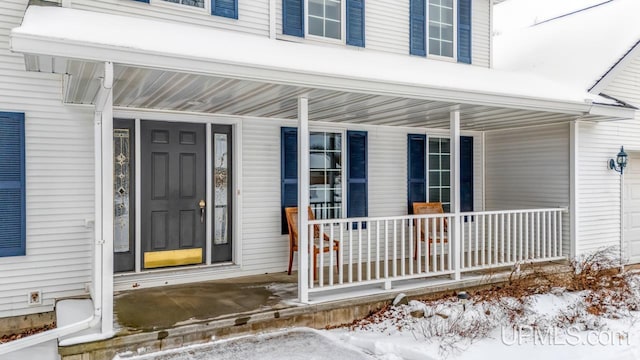 view of snow covered property entrance