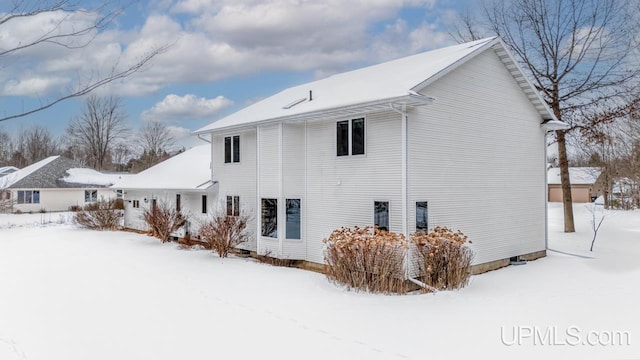 view of snow covered house