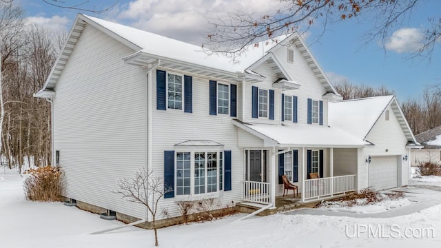 view of front of home with a garage and covered porch