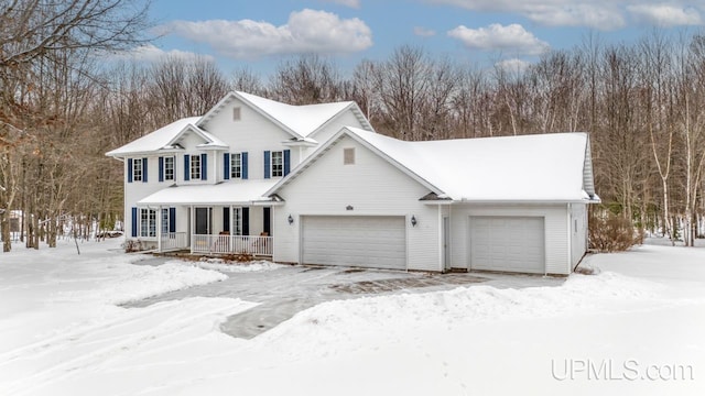 view of front of property featuring a garage and covered porch