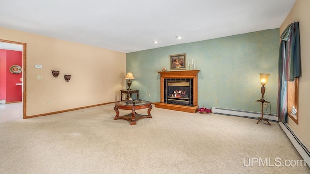 sitting room with a tiled fireplace, light carpet, and baseboard heating