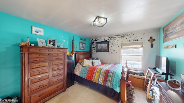 bedroom featuring light carpet