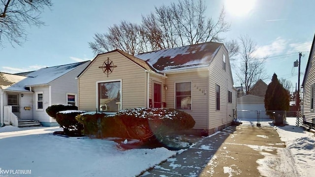 bungalow-style home with an outbuilding and a garage