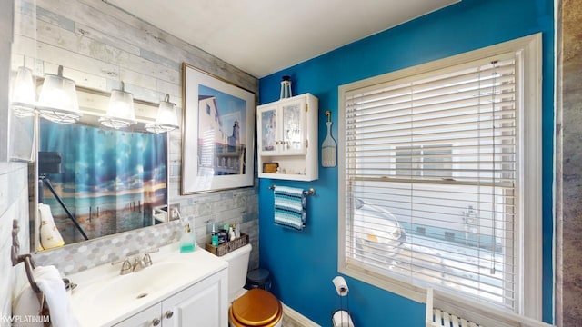 bathroom featuring vanity and toilet