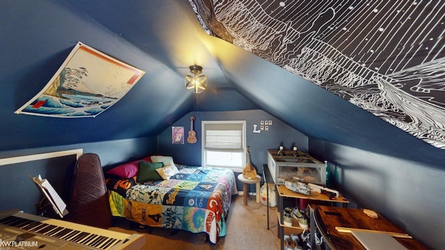 bedroom featuring lofted ceiling and carpet