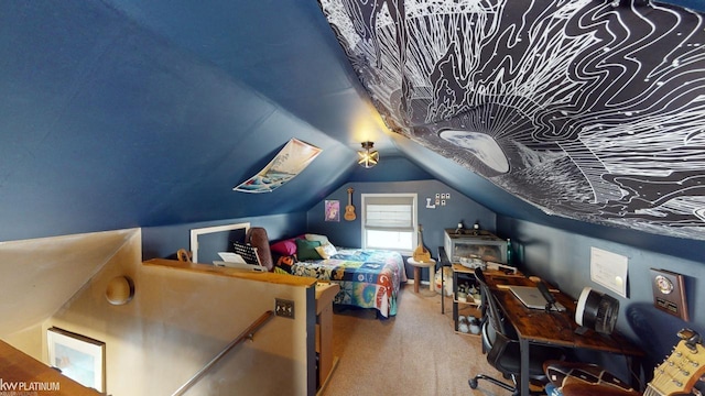 bedroom with vaulted ceiling and carpet flooring