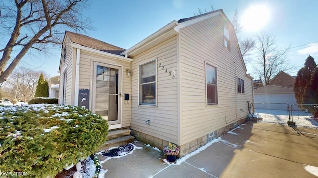 view of front of house with a garage and an outdoor structure