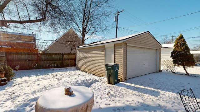 view of snow covered garage