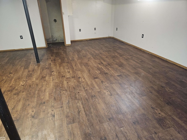 basement featuring dark hardwood / wood-style floors