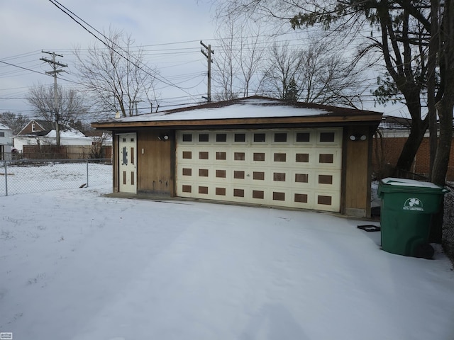 view of snow covered garage