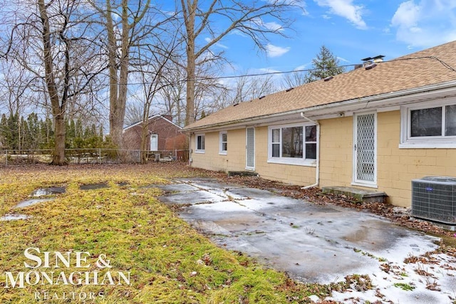 back of property featuring a patio area and central air condition unit