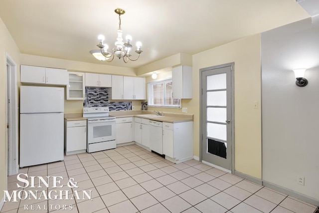 kitchen featuring tasteful backsplash, white appliances, decorative light fixtures, and white cabinets