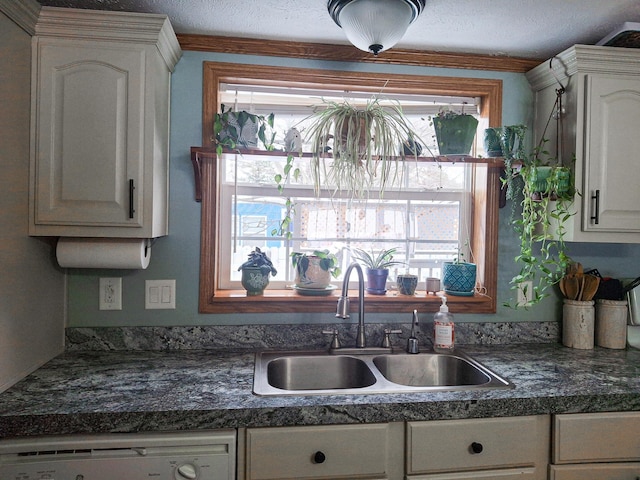 kitchen with sink, white cabinetry, a textured ceiling, ornamental molding, and white dishwasher