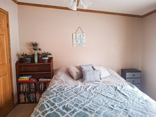 bedroom with crown molding and carpet flooring