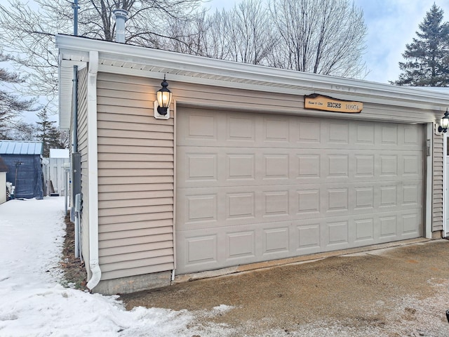 view of snow covered garage