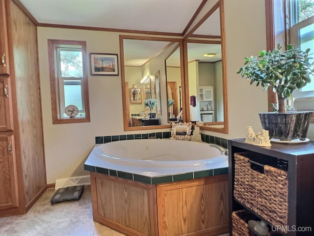 bathroom with a washtub and crown molding