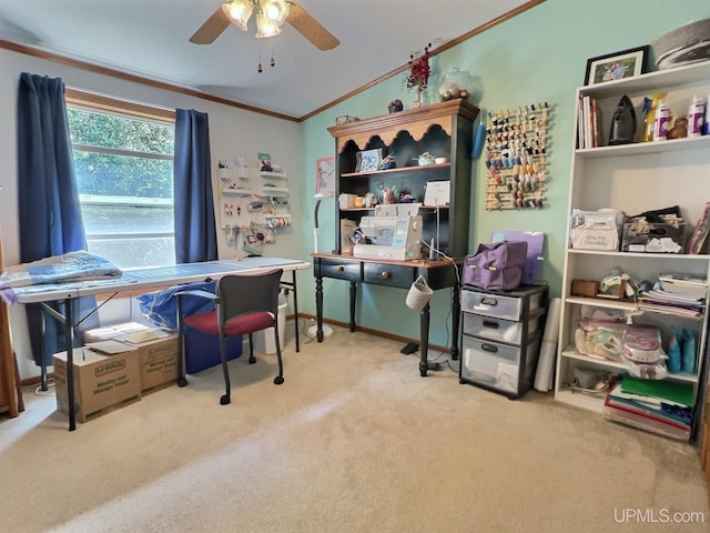 office area featuring lofted ceiling, crown molding, light carpet, and ceiling fan