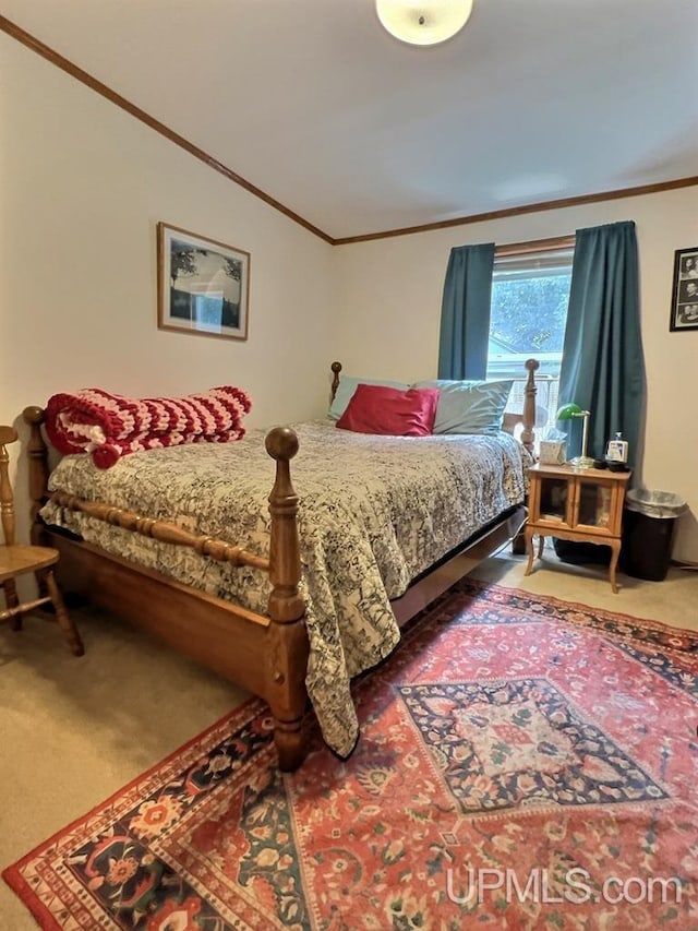 bedroom featuring crown molding and carpet flooring