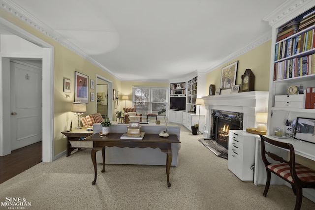 carpeted living room featuring ornamental molding and a premium fireplace