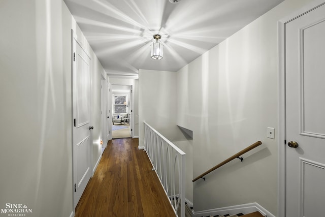 hallway with dark wood-type flooring