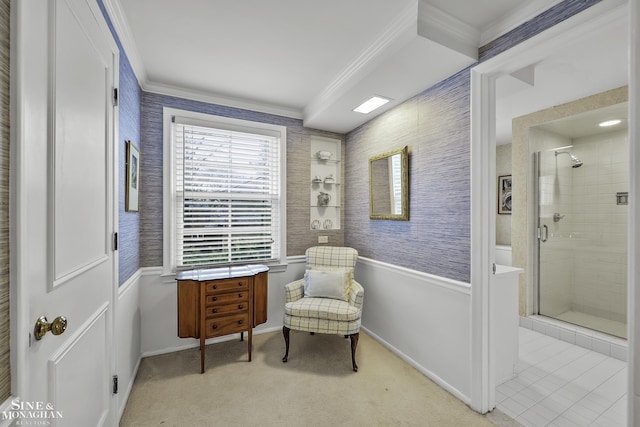 sitting room featuring ornamental molding and light carpet