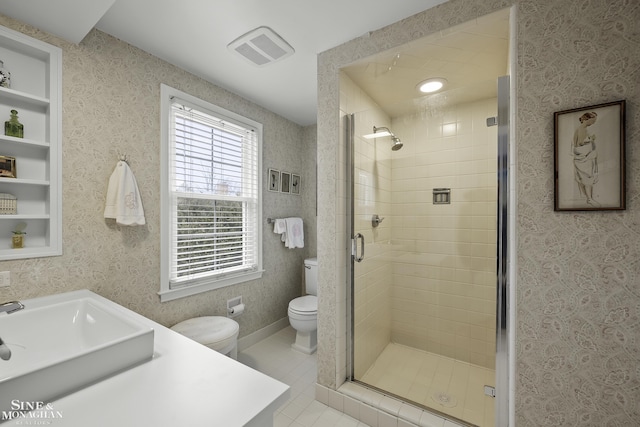 bathroom featuring an enclosed shower, vanity, tile patterned flooring, and toilet