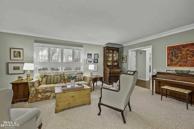 carpeted living room featuring ornamental molding