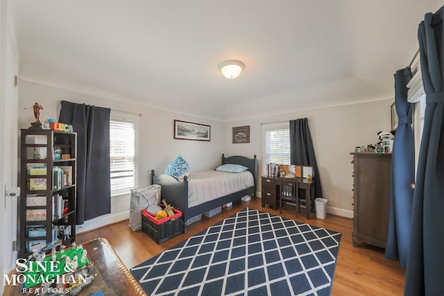 bedroom with wood-type flooring