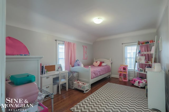 bedroom with dark wood-type flooring and vaulted ceiling