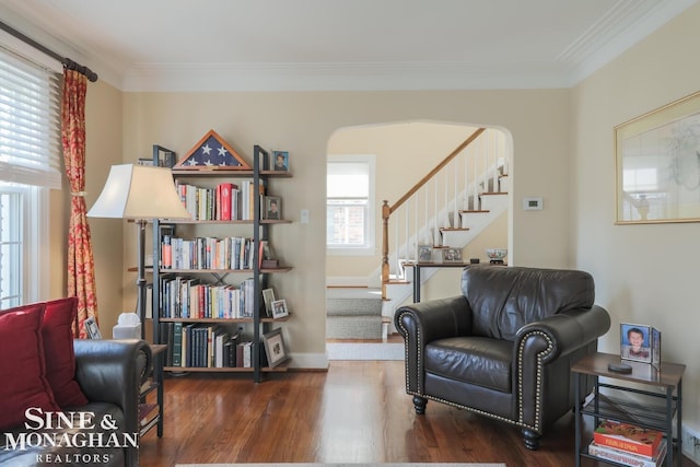 sitting room featuring crown molding and dark hardwood / wood-style flooring