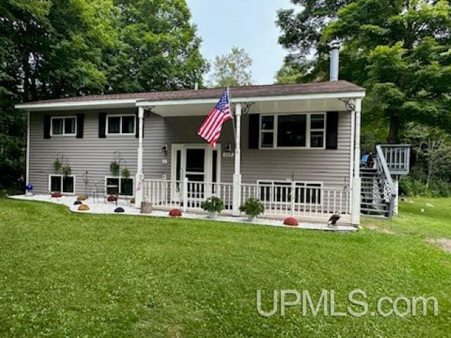 back of house with a lawn