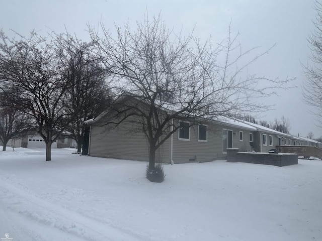 view of snow covered property