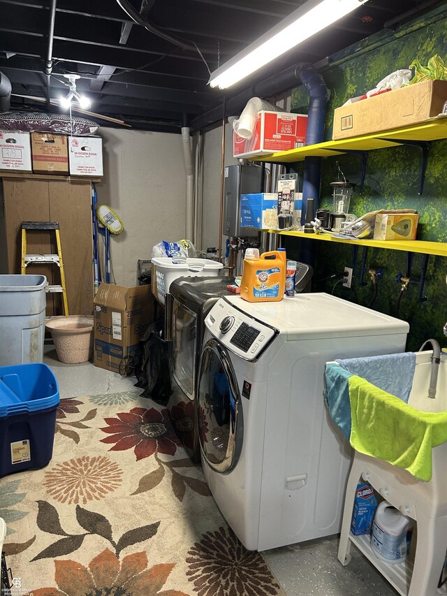 washroom featuring laundry area and independent washer and dryer