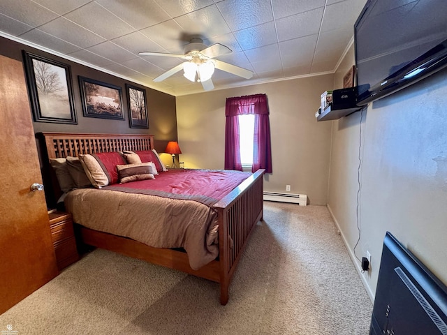 bedroom featuring crown molding, carpet floors, ceiling fan, and baseboard heating