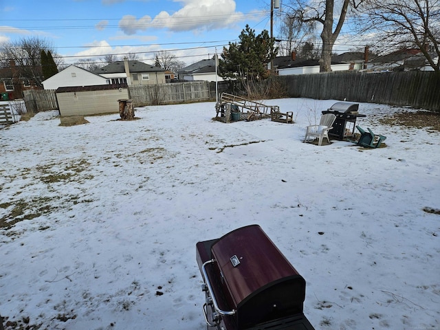 view of yard covered in snow