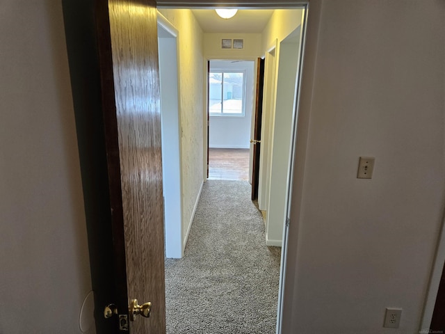 hallway with light carpet