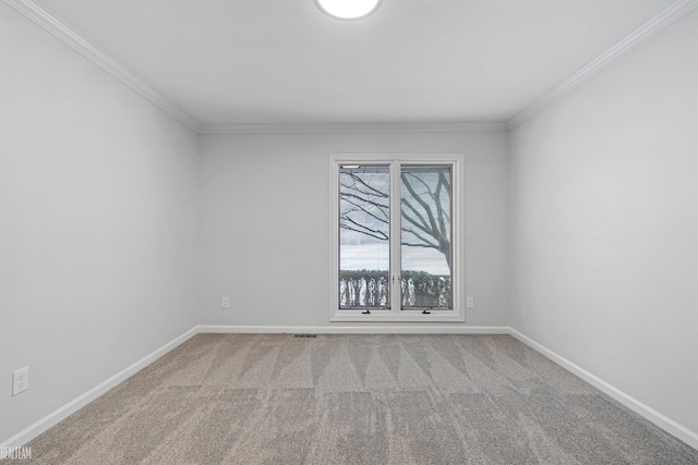 empty room with crown molding and light carpet