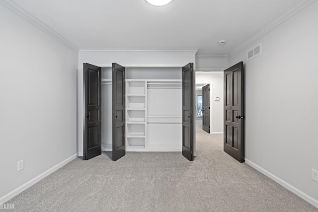 unfurnished bedroom with crown molding and light colored carpet