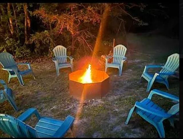 view of patio / terrace with an outdoor fire pit