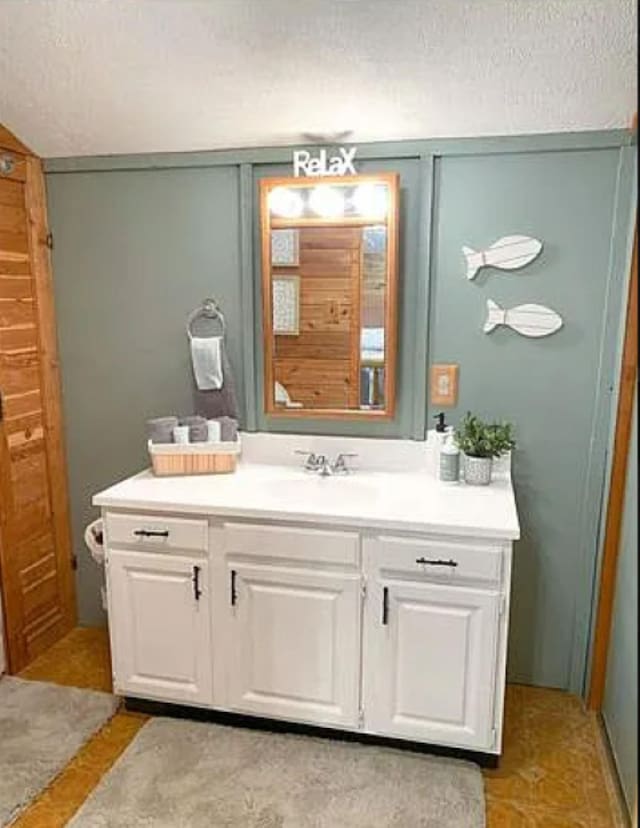 bathroom featuring vanity and a textured ceiling