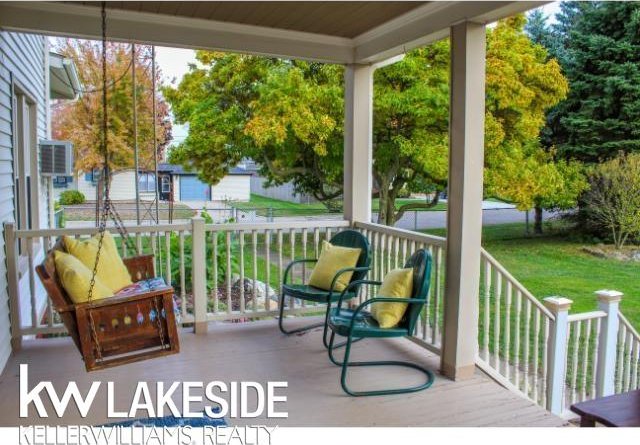 deck featuring a yard and a porch