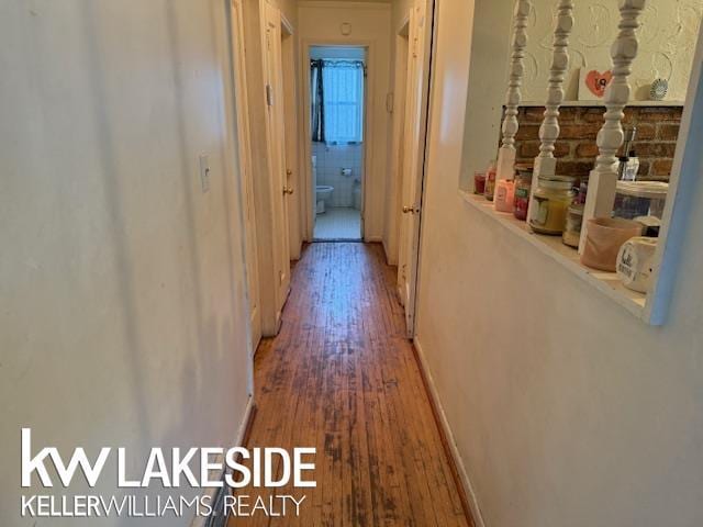 hallway featuring wood-type flooring