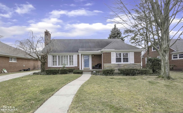 ranch-style house with a front lawn