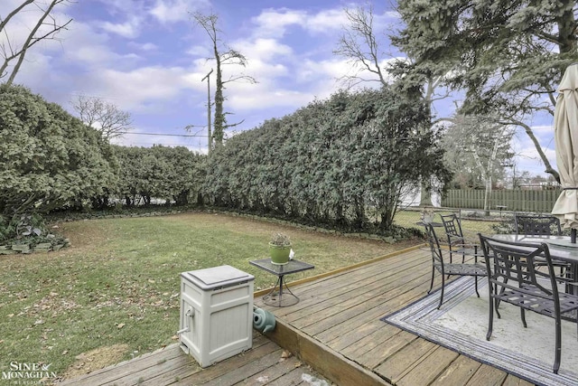 wooden terrace with a yard