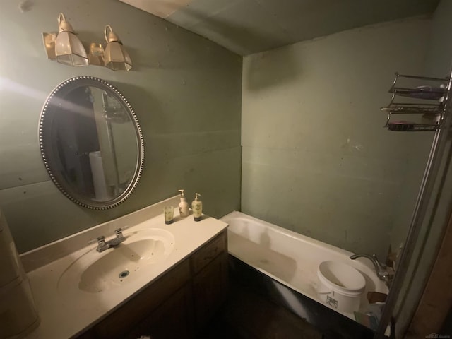 bathroom with vanity and a washtub