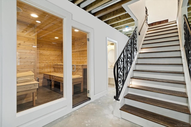 view of sauna featuring concrete floors