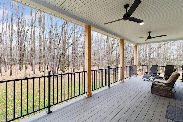 wooden deck featuring ceiling fan